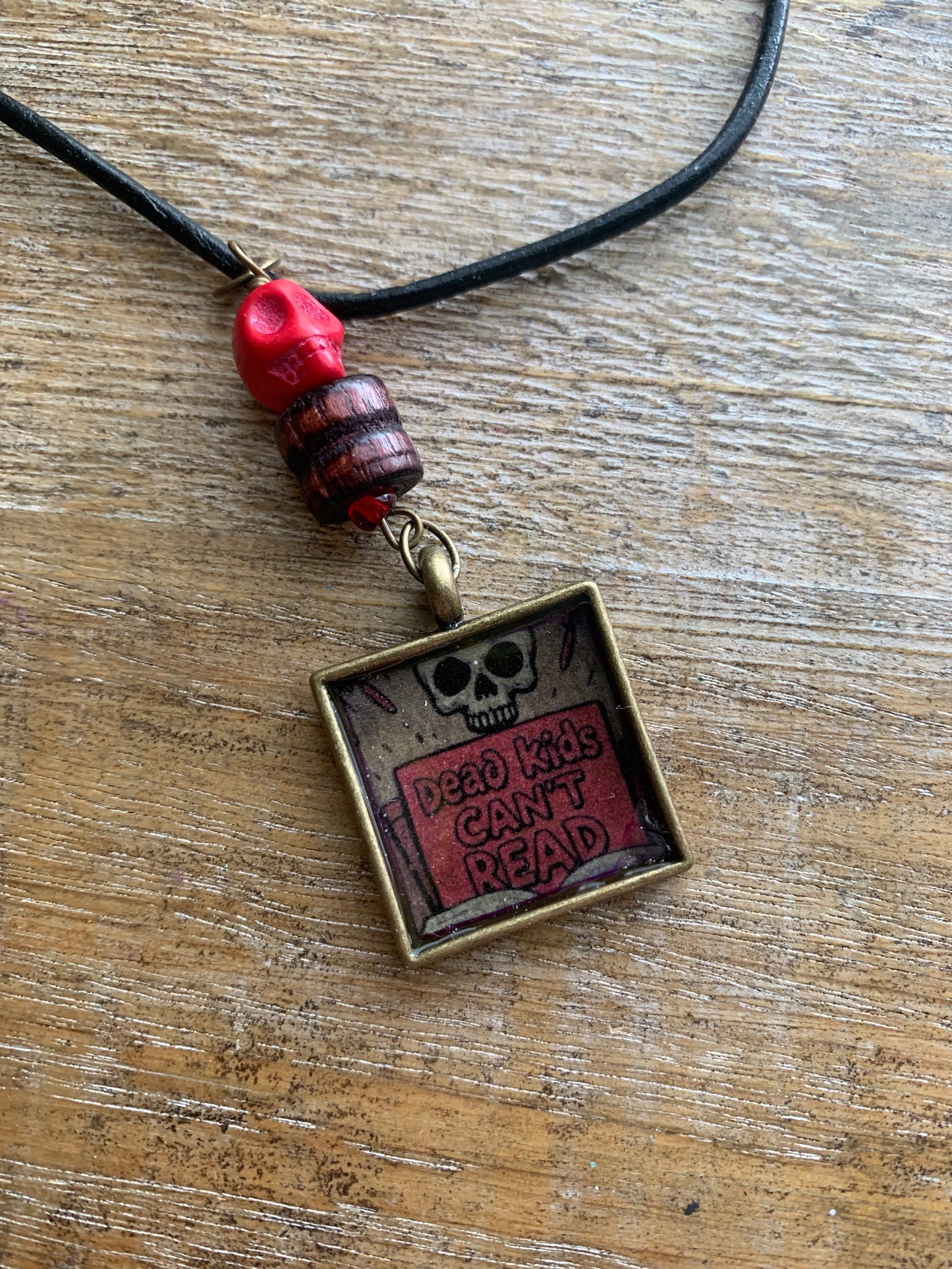 Dead Kids Can’t Read Pendant Necklace Beaded Bronze Tone Gun Control Necklace