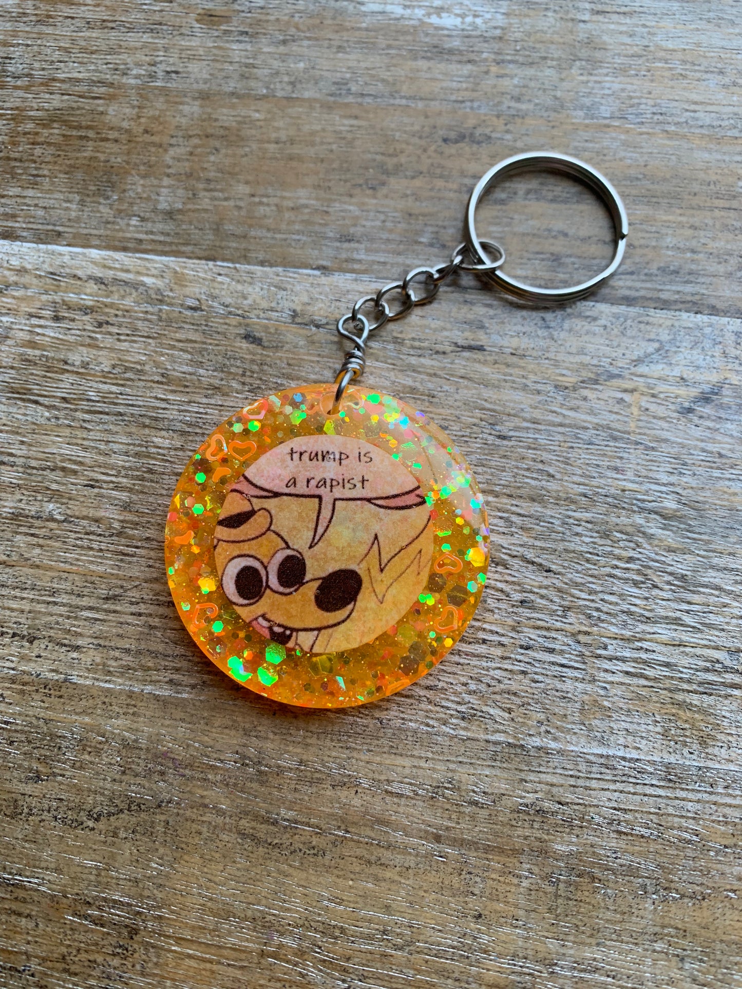 Trump is a Rapist Meme Fire Dog Keychain Orange Circle Keyring