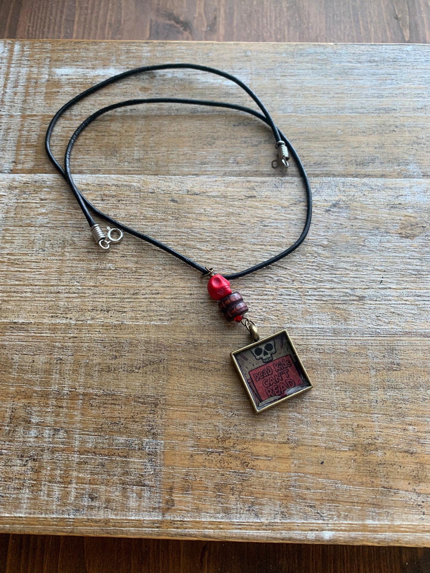 Dead Kids Can’t Read Pendant Necklace Beaded Bronze Tone Gun Control Necklace
