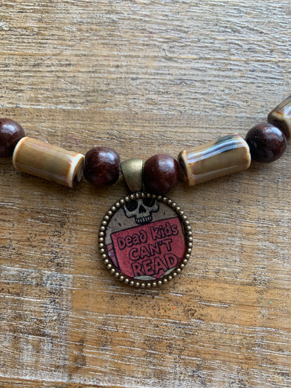 Dead Kids Can’t Read Pendant Necklace Beaded Bronze Tone Gun Control Necklace