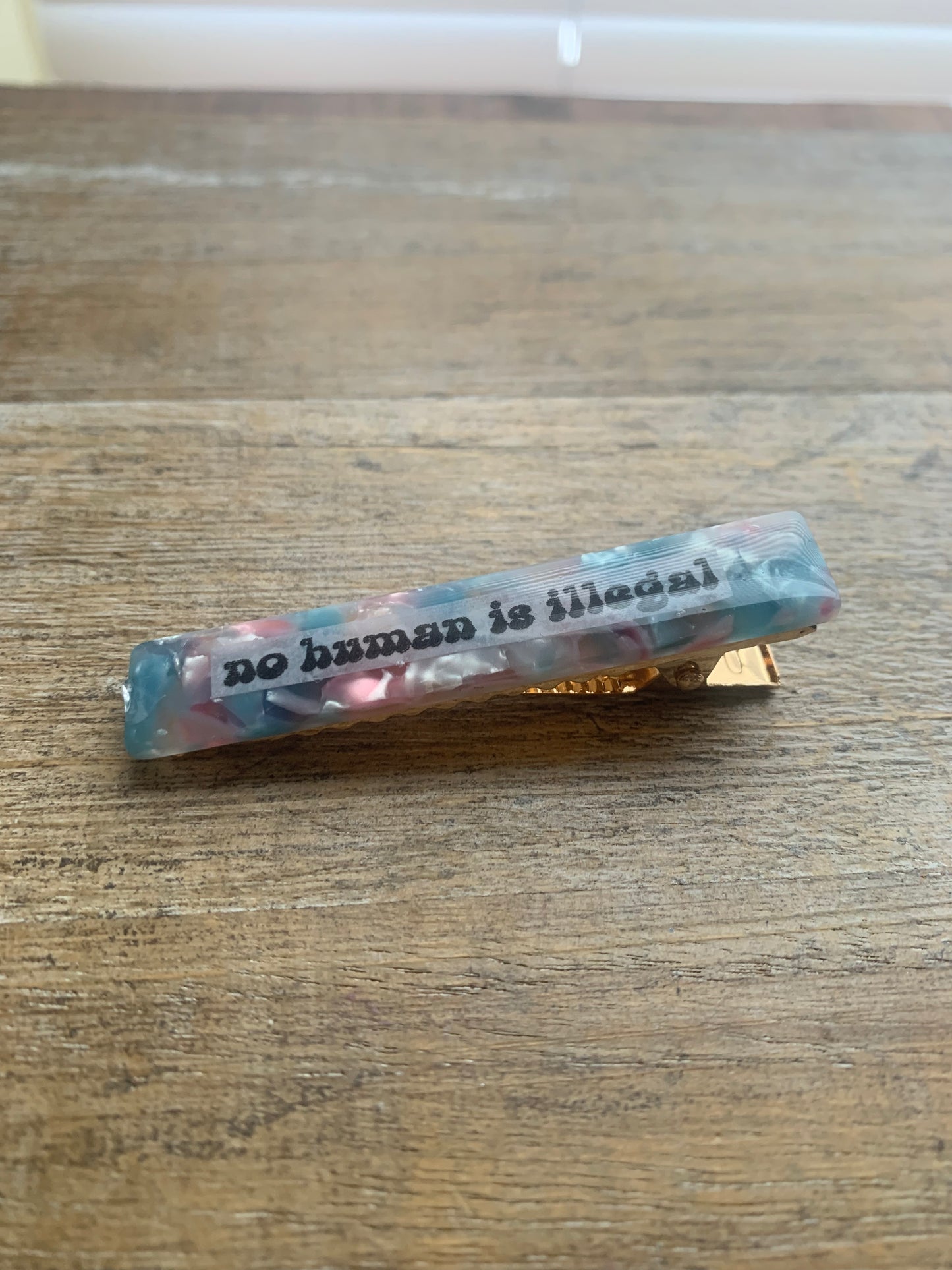 As-Is No Human Is Illegal Pastel Color Liberal Protest Hair Clip