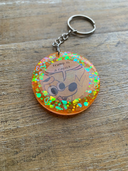 Trump is a Rapist Meme Fire Dog Keychain Orange Circle Keyring
