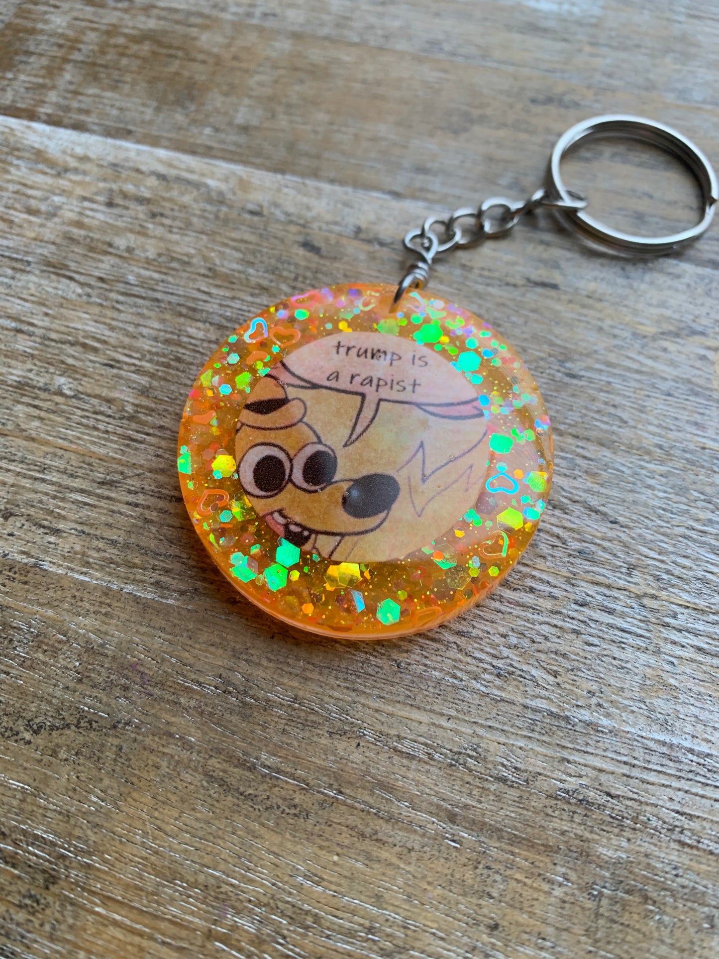 Trump is a Rapist Meme Fire Dog Keychain Orange Circle Keyring