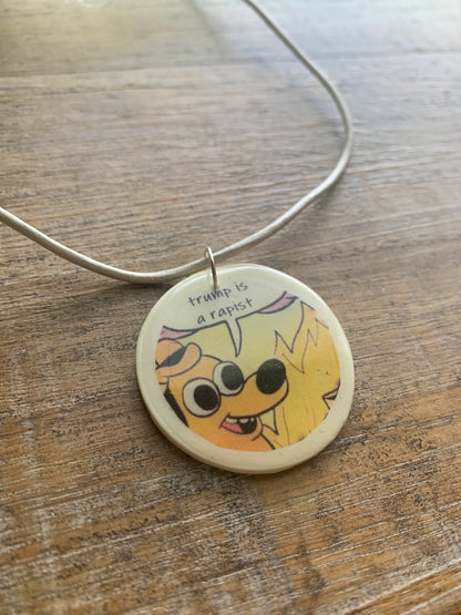 Trump Is a Rapist Fire Meme Necklace