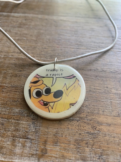 Trump Is a Rapist Fire Meme Necklace